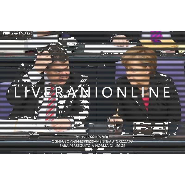 (140409) -- BERLIN, April 9, 2014 () -- German Chancellor Angela Merkel (R) speaks to German Vice Chancellor, Economy and Energy Minister Sigmar Gabriel during a debate on the 2014 federal budget at the Bundestag, the lower house of parliament, in Berlin, Germany, on April 9, 2014. (/Zhang Fan) (djj) AG ALDO LIVERANI SAS ONLY ITALY