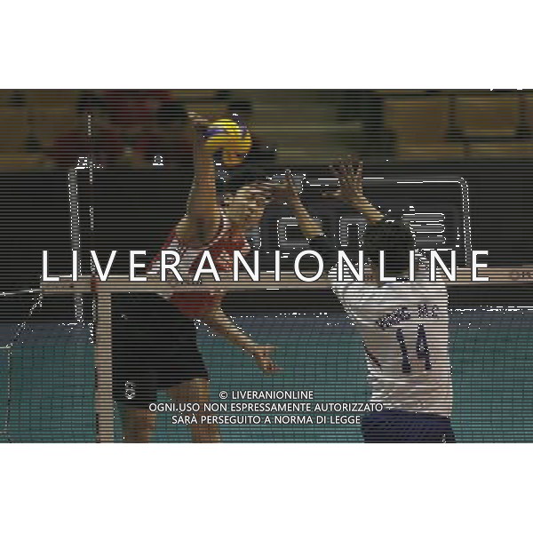(140409) -- PASAY CITY, April 9, 2014 () -- Zhang Binglong (L) of China spikes the ball against Wang Ming Chun of Chinese Taipei during the preliminary of the 2014 Asian Men\'s Club Volleyball Championship in Pasay City, the Philippines, April 9, 2014. China won 3-1. (/Rouelle Umali) AG ALDO LIVERANI SAS ONLY ITALY