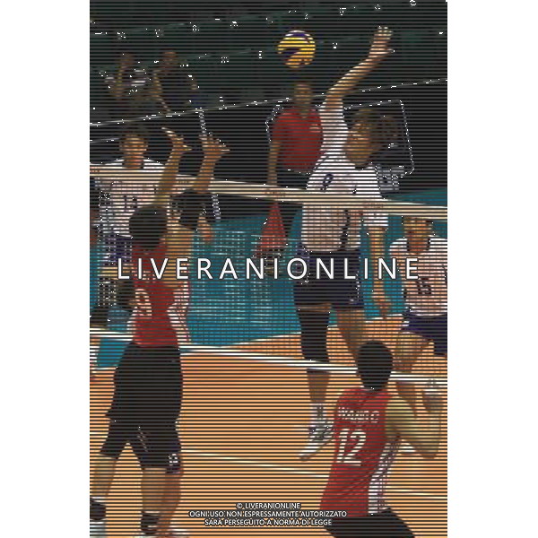 (140409) -- PASAY CITY, April 9, 2014 () -- Chiang Tien Yu (Above) of Chinese Taipei spikes the ball against Yang Fan (L) and Wang Chen (R) of China during the preliminary of the 2014 Asian Men\'s Club Volleyball Championship in Pasay City, the Philippines, April 9, 2014. China won 3-1. (/Rouelle Umali) AG ALDO LIVERANI SAS ONLY ITALY