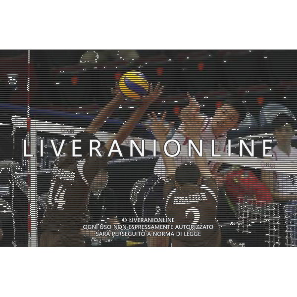 (140409) -- PASAY CITY, April 9, 2014 () -- Cheong Hung Siu (R) of Hong Kong of China spikes the ball during the preliminary round of the 2014 Asian Men\'s Club Volleyball Championship against Oman in Pasay City, the Philippines, April 9, 2014. Oman won 3-1. (/Rouelle Umali) AG ALDO LIVERANI SAS ONLY ITALY