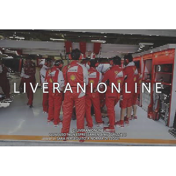 Ferrari mechanics create a human shield around the Ferrari F14-T of Kimi Raikkonen (FIN) Ferrari. 18.04.2014. Formula 1 World Championship, Rd 4, Chinese Grand Prix, Shanghai, China, Practice Day. - www.xpbimages.com, EMail: requests@xpbimages.com - copy of publication required for printed pictures. Every used picture is fee-liable. Â© Copyright: Moy / XPB Images /Ag. Aldo Liverani s.a.s.-Only Italy-Editorial Use Only