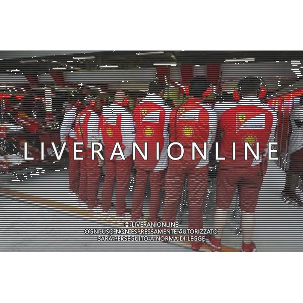 Ferrari mechanics create a human shield around the Ferrari F14-T of Kimi Raikkonen (FIN) Ferrari. 18.04.2014. Formula 1 World Championship, Rd 4, Chinese Grand Prix, Shanghai, China, Practice Day. - www.xpbimages.com, EMail: requests@xpbimages.com - copy of publication required for printed pictures. Every used picture is fee-liable. Â© Copyright: Moy / XPB Images /Ag. Aldo Liverani s.a.s.-Only Italy-Editorial Use Only