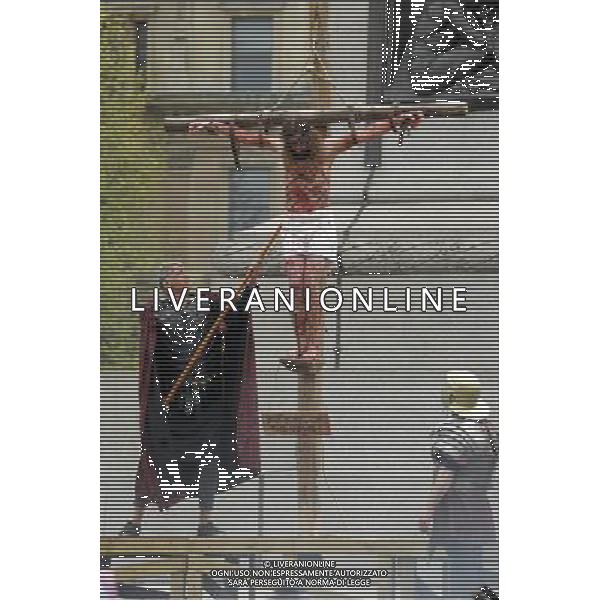 The Passion of Jesus performed in Trafalgar Square on Good Friday 18/04/2014. Jesus is crucified in Trafalgar Square and the roman guard checks he is dead. Picture by Julie Edwards ©Photoshot/Ag. Aldo Liverani s.a.s.-Only Italy-Editorial Use Only