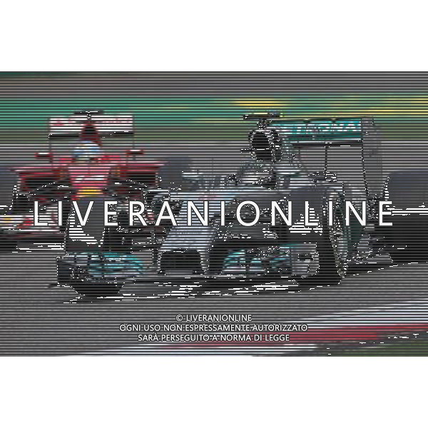 Nico Rosberg (GER), Mercedes AMG F1 Team and Fernando Alonso (ESP), Scuderia Ferrari 20.04.2014. Formula 1 World Championship, Rd 4, Chinese Grand Prix, Shanghai, China, Race Day. - www.xpbimages.com, EMail: requests@xpbimages.com - copy of publication required for printed pictures. Every used picture is fee-liable. © Copyright: Charniaux / XPB Images /Ag. Aldo Liverani s.a.s.-Only Italy-Editorial Use Only