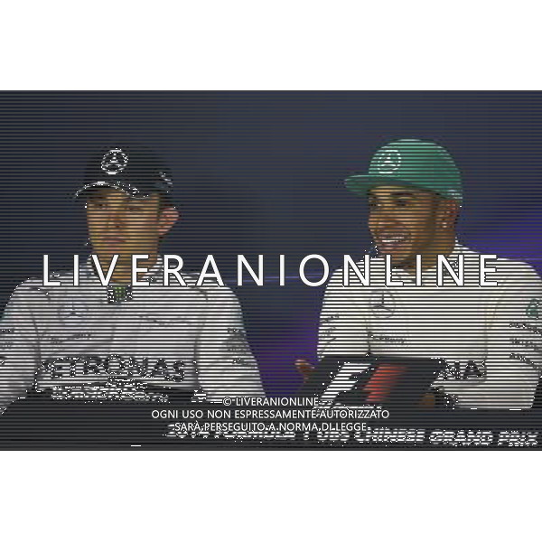 (L to R): Nico Rosberg (GER) Mercedes AMG F1 with team mate Lewis Hamilton (GBR) Mercedes AMG F1 in the FIA Press Conference. 20.04.2014. Formula 1 World Championship, Rd 4, Chinese Grand Prix, Shanghai, China, Race Day. - www.xpbimages.com, EMail: requests@xpbimages.com - copy of publication required for printed pictures. Every used picture is fee-liable. © Copyright: Price / XPB Images /Ag. Aldo Liverani s.a.s.-Only Italy-Editorial Use Only