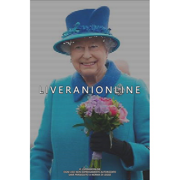 NARBETH, WALES - APRIL 29: Queen Elizabeth II holds a posy of flowers during an official visit to Cotts Farm Equine Hospital, Narbeth on April 29, 2014 in Narbeth, Wales. The Cotts Equine Hospital is a purpose-built facility offering veterinary equine care. AG ALDO LIVERANI SAS ONLY ITALY