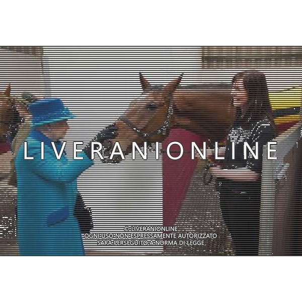 NARBETH, WALES - APRIL 29: Queen Elizabeth II with horse Teaforthree and Rebecca Morris (R) of Cotts Farm Equine Hospital during an official visit to Cotts Farm Equine Hospital, Narbeth on April 29, 2014 in Narbeth, Wales. The Cotts Equine Hospital is a purpose-built facility offering veterinary equine care. AG ALDO LIVERANI SAS ONLY ITALY