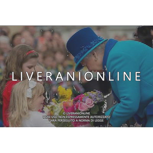 NARBETH, WALES - APRIL 29: Queen Elizabeth II accepts flowers during an official visit to Cotts Farm Equine Hospital, Narbeth on April 29, 2014 in Narbeth, Wales. The Cotts Equine Hospital is a purpose-built facility offering veterinary equine care. AG ALDO LIVERANI SAS ONLY ITALY