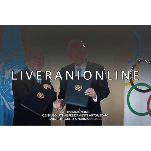 (140429) -- New York, April 29, 2014 () -- United Nations Secretary-General Ban Ki-moon (R) and International Olympic Committee chief Thomas Bach pose for a picture after signing an agreement at the UN headquarters in New York, on April 28, 2014. UN Secretary-General Ban Ki-moon and International Olympic Committee chief Thomas Bach signed an agreement on Monday aimed at strengthening collaboration between the two organizations to promote the role of sport in development and peace. The IOC, which was granted UN Observer Status in 2009, has long enjoyed strong ties with individual UN agencies, working with them globally on a number of initiatives that use sport as a tool for development and peace. (/Niu Xiaolei) AG ALDOL IVERANI SAS ONLY ITALY