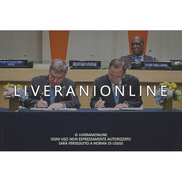 (140429) -- New York, April 29, 2014 () -- United Nations Secretary-General Ban Ki-moon (front R) and International Olympic Committee chief Thomas Bach (front L) sign an agreement at the UN headquarters in New York, on April 28, 2014. UN Secretary-General Ban Ki-moon and International Olympic Committee chief Thomas Bach signed an agreement on Monday aimed at strengthening collaboration between the two organizations to promote the role of sport in development and peace. The IOC, which was granted UN Observer Status in 2009, has long enjoyed strong ties with individual UN agencies, working with them globally on a number of initiatives that use sport as a tool for development and peace. (/Niu Xiaolei) AG ALDOL IVERANI SAS ONLY ITALY