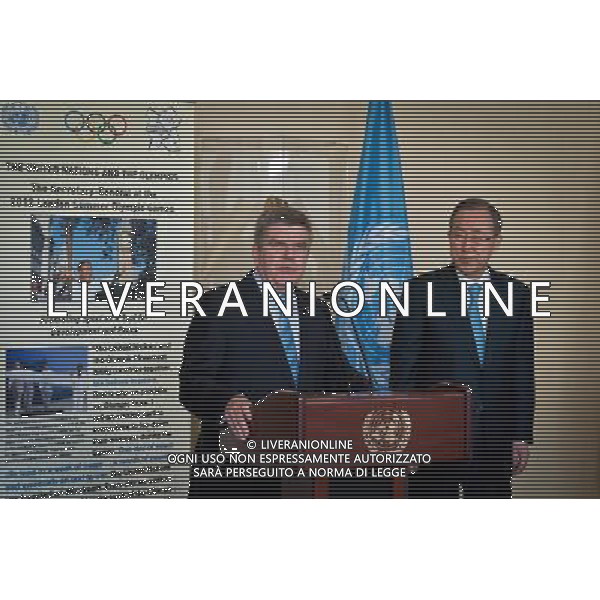 (140429) -- New York, April 29, 2014 () -- International Olympic Committee chief Thomas Bach (L) speaks to media reporters as United Nations Secretary-General Ban Ki-moon looks on at the UN headquarters in New York, on April 28, 2014. UN Secretary-General Ban Ki-moon and International Olympic Committee chief Thomas Bach signed an agreement on Monday aimed at strengthening collaboration between the two organizations to promote the role of sport in development and peace. The IOC, which was granted UN Observer Status in 2009, has long enjoyed strong ties with individual UN agencies, working with them globally on a number of initiatives that use sport as a tool for development and peace. (/Niu Xiaolei) AG ALDOL IVERANI SAS ONLY ITALY