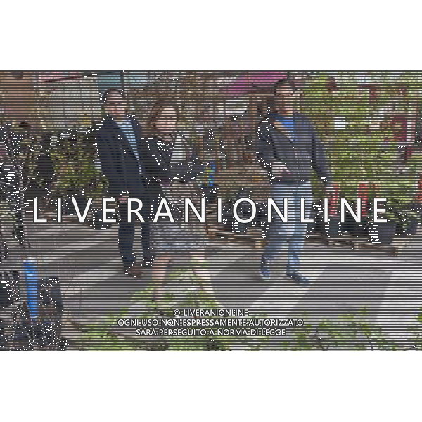 NYC City Council Speaker Melissa Mark-Viverto, center, with NYRP employee John Douglas, right, at the Urban Garden Center in East Harlem in New York on Sunday, April 27, 2014 at one of the New York Restoration Project\'s tree giveaways.The giveaway is part of the MillionTreesNYC initiative started in 2007 as part of the city\'s long term sustainability program. The goal is to increase the \'urban forest\', comprised of street, park, public and private trees, to the betterment of the quality of life for New Yorkers. ©photoshot/AGENZIA ALDO LIVERANI SAS - ITALY ONLY - Vedute della citta\' di New York - Vita quotidiana