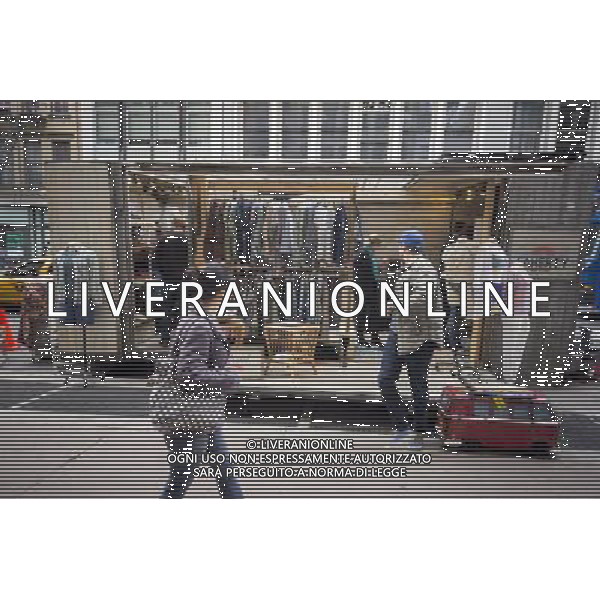 Passer-by on Broadway in the Soho neighborhood of New York ignore and observe the Faherty Brand pop-up clothing shop on Saturday, April 24, 2014. The mobile \'beach house\' is part of the brand\'s signature and was parked in front of Bloomingdale Soho as part of the store\'s 20th anniversary. The lifestyle brand was founded by twin brothers Alex and Mike Faherty. ©photoshot/AGENZIA ALDO LIVERANI SAS - ITALY ONLY - Vedute della citta\' di New York - Vita quotidiana