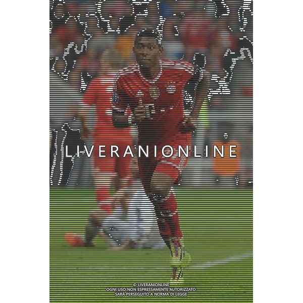 29.04.2014, Allianz Arena, Muenchen, GER, UEFA CL, FC Bayern Muenchen vs Real Madrid, Halbfinale, Ruckspiel, im Bild David Alaba (FC Bayern Muenchen) auf dem Weg zum Eckball. // during the UEFA Champions League Round of 4, 2nd Leg Match between FC Bayern Munich vs Real Madrid at the Allianz Arena in Muenchen, Germany on 2014/04/30. EXPA Pictures © 2014, PhotoCredit: EXPA/ Eibner-Pressefoto/ Stuetzle *****ATTENTION - OUT of GER***** ©PHOTOSHOT/AGENZIA ALDO LIVERANI SAS - ITALY ONLY - EDITORIAL USE ONLY - BAYERN MONACO - REAL MADRID SEMIFINALE DI RITORNO CHAMPIONS LEAGUE