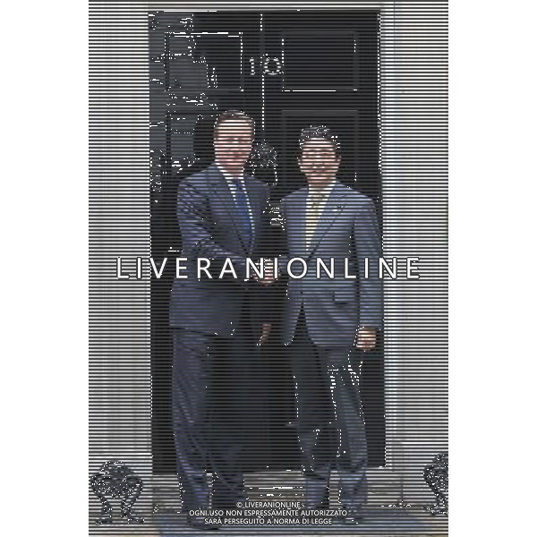 UK Prime Minister, David Cameron shakes hands with the Japanese Prime Minister Shinzo Abe as he arrives at 10 Downing Street in London, England on May 1, 2014. The Prime Minister of Japan has started a European tour to promote Japanese trade. AG ALDOL IVERANI SAS ONLY ITALY