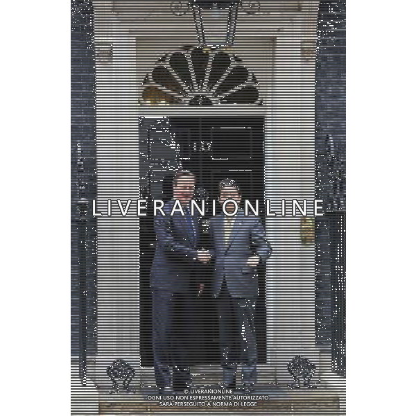 UK Prime Minister, David Cameron shakes hands with the Japanese Prime Minister Shinzo Abe as he arrives at 10 Downing Street in London, England on May 1, 2014. The Prime Minister of Japan has started a European tour to promote Japanese trade. AG ALDOL IVERANI SAS ONLY ITALY