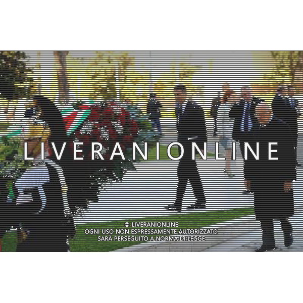 (140501) -- ROME, May 1, 2014 () -- Italian President Giorgio Napolitano (1st R) lays a wreath to the monument dedicated to wokers who perished on duty in Rome, Italy, on May 1, 2014. Italian President Giorgio Napolitano attended a wreath-laying ceremony in front of the monument dedicated to wokers who perished on duty in Rome\'s Giulio Pastore square Thursday morning, marking the International Labor Day. ( Xu Nizhi) AG ALDOL IVERANI SAS ONLY ITALY