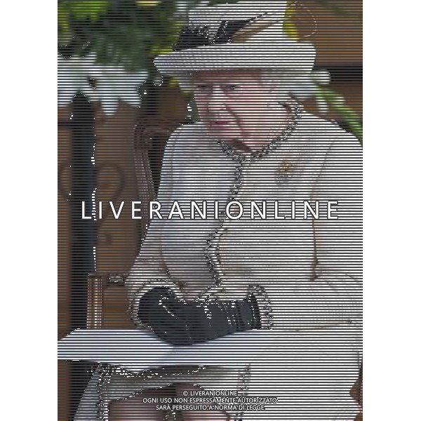 FELSTED, ENGLAND - MAY 06: Queen Elizabeth II looks on during an official visit to Felsted School on May 6, 2014 in Felsted, England. Her Majesty unveiled two plaques to commemorate the School\'s 450th anniversary and completion of a new boarding house. AG ALDO LIVERANI SAS ONLY ITALY