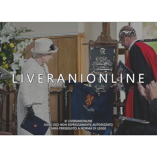 FELSTED, ENGLAND - MAY 06: Queen Elizabeth II unveils a plaque during an official visit to Felsted School on May 6, 2014 in Felsted, England. Her Majesty unveiled two plaques to commemorate the School\'s 450th anniversary and completion of a new boarding house. AG ALDO LIVERANI SAS ONLY ITALY
