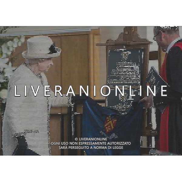 FELSTED, ENGLAND - MAY 06: Prince Phillip, Duke of Edinburgh and Queen Elizabeth II meet staff during an official visit to Felsted School on May 6, 2014 in Felsted, England. Her Majesty unveiled two plaques to commemorate the School\'s 450th anniversary and completion of a new boarding house. AG ALDO LIVERANI SAS ONLY ITALY