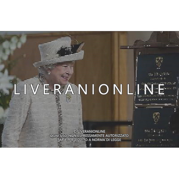 FELSTED, ENGLAND - MAY 06: Queen Elizabeth II unveils a plaque during an official visit to Felsted School on May 6, 2014 in Felsted, England. Her Majesty unveiled two plaques to commemorate the School\'s 450th anniversary and completion of a new boarding house. AG ALDO LIVERANI SAS ONLY ITALY