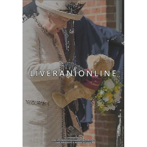 FELSTED, ENGLAND - MAY 06: Queen Elizabeth II receives flowers during an official visit to Felsted School on May 6, 2014 in Felsted, England. Her Majesty unveiled two plaques to commemorate the School\'s 450th anniversary and completion of a new boarding house. AG ALDO LIVERANI SAS ONLY ITALY