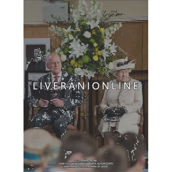FELSTED, ENGLAND - MAY 06: Prince Phillip, Duke of Edinburgh and Queen Elizabeth II sit on stage during their official visit to Felsted School on May 6, 2014 in Felsted, England. Her Majesty unveiled two plaques to commemorate the School\'s 450th anniversary and completion of a new boarding house. AG ALDO LIVERANI SAS ONLY ITALY