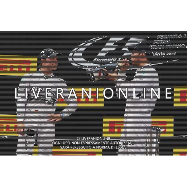 (L to R): second placed Nico Rosberg (GER) Mercedes AMG F1 celebrates with team mate and race winner Lewis Hamilton (GBR) Mercedes AMG F1. 11.05.2014. Formula 1 World Championship, Rd 5, Spanish Grand Prix, Barcelona, Spain, Race Day. - www.xpbimages.com, EMail: requests@xpbimages.com - copy of publication required for printed pictures. Every used picture is fee-liable. © Copyright: Moy / XPB Images AG ALDO LIVERANI SAS ONLY ITALY