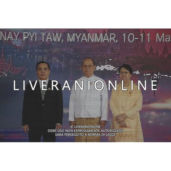(140511) -- NAY PYI TAW, May 11, 2014 () -- Laos Prime Minister Thongsing Thammavong (L) poses for photos with Myanmar\'s President U Thein Sein (C) and his wife Khin Khin Win before the opening ceremony of the 24th ASEAN Summit at Myanmar International Convention Center (MICC) in Nay Pyi Taw, Myanmar, May 11, 2014. The 24th Association of Southeast Asian Nations (ASEAN) leaders\' meeting opened here Sunday morning, an event that Myanmar President U Thein Sein described as a symbol of \'unity and dedication for building a better future for the region and the peoples.\' (/U Aung) ©PHOTOSHOT/AGENZIA ALDO LIVERANI SAS - ITALY ONLY - EDITORIAL USE ONLY