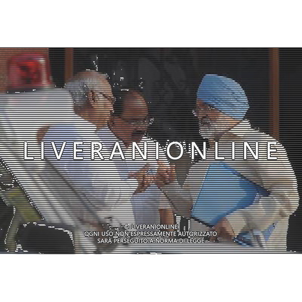 (140513) -- NEW DELHI, May 13, 2014 () -- Indian Railway Minister Mallikarjun Kharge (L) talks with Petroleum Minister Veerappa Moily (C) and Deputy Chairman of India\'s Planning Commission Montek Singh Ahluwalia as they walk out of Prime Minister\'s office at South Block after attending the last cabinet meeting of the incumbent United Progressive Alliance (UPA) Government in New Delhi, capital of India, on May 13, 2014. India on Monday concluded its ninth and final phase of the Lok Sabha election with a record high turnout of over 66 percent throughout the polling for over a month, said election officials and media report. (/Partha Sarkar) ©PHOTOSHOT/AGENZIA ALDO LIVERANI SAS - ITALY ONLY - EDITORIAL USE ONLY