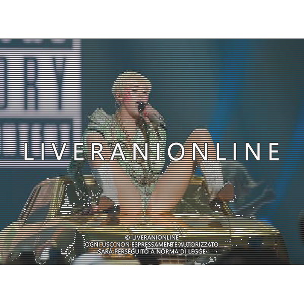 Miley Cyrus performing at Phone 4u Arena, Manchester, England on 14th May 2014. Â©Photoshot/Ag. Aldo Liverani s.a.s.-Only Italy-Editorial Use Only