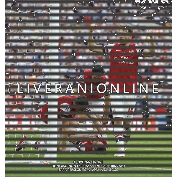 Arsenal\'s Aaron Ramsey celebrates Arsenal\'s Laurent Koscielny\'s equalising goal 2-2 Photographer Karyn Haddon/CameraSport Football - FA Challenge Cup Final - Arsenal v Hull City - Saturday 17th May 2014 - Wembley Stadium - London Â© CameraSport - 43 Linden Ave. Countesthorpe. Leicester. England. LE8 5PG - Tel: +44 (0) 116 277 4147 - admin@camerasport.com - www.camerasport.com AG ALDOL IVERANI SAS ONLY ITALY