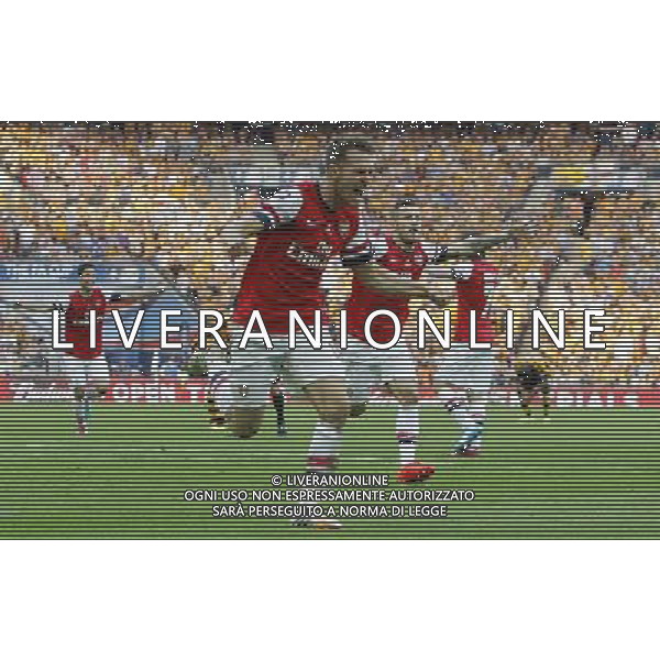 Arsenal\'s Aaron Ramsey celebrates scoring his sides third goal 3-2 Photographer Karyn Haddon/CameraSport Football - FA Challenge Cup Final - Arsenal v Hull City - Saturday 17th May 2014 - Wembley Stadium - London Â© CameraSport - 43 Linden Ave. Countesthorpe. Leicester. England. LE8 5PG - Tel: +44 (0) 116 277 4147 - admin@camerasport.com - www.camerasport.com AG ALDOL IVERANI SAS ONLY ITALY