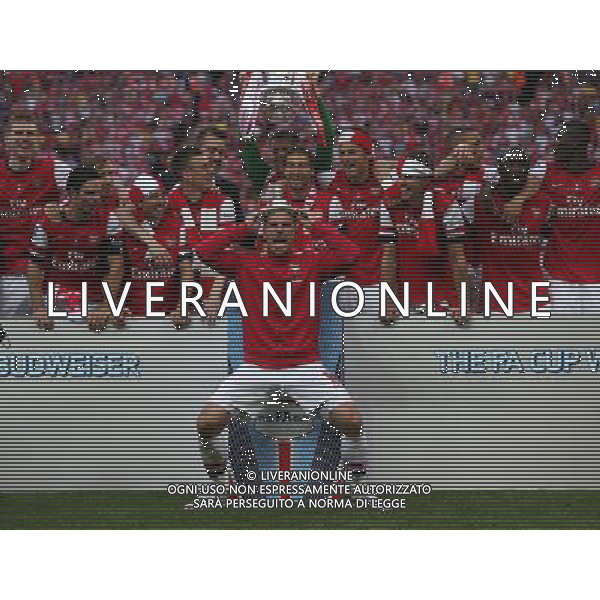 Lukas Podolski Of Arsenal with Trophy Photographer Kieran Galvin/CameraSport Football - FA Challenge Cup Final - Arsenal v Hull City - Saturday 17th May 2014 - Wembley Stadium - London Â© CameraSport - 43 Linden Ave. Countesthorpe. Leicester. England. LE8 5PG - Tel: +44 (0) 116 277 4147 - admin@camerasport.com - www.camerasport.com AG ALDOL IVERANI SAS ONLY ITALY