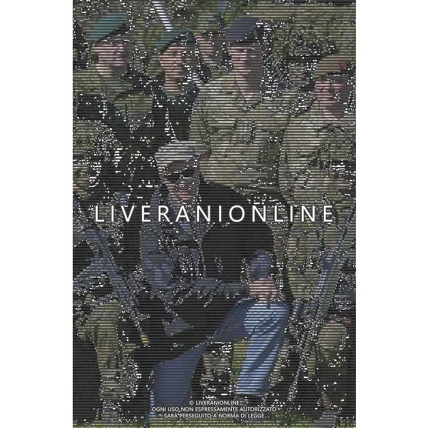 (140517) -- POLGASTE, May 17, 2014 () -- Britain\'s Prince Harry(back, C) and Estonian President Toomas Hendrik Ilves(front, C) meet British soldiers on May 17, 2014 during a visit to the Estonian Defence Forces annual pring Stormtraining exercises held near Polgaste, not far from Estonian-Russian border in South Estonia. (/Sergei Stepanov) AG ALDO LIVERANI SAS ONLY ITALY