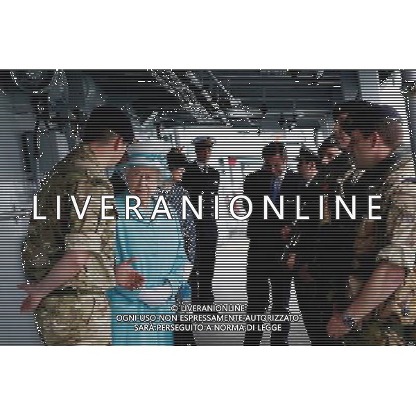 PORTSMOUTH, ENGLAND - MAY 20: Queen Elizabeth II meets members of the Boarding Team who were involved in successful counter-narcotics operations with HMS Lancaster, during a royal visit to Portsmouth Naval Base on May 20, 2014 in Portsmouth, England. HMS Lancaster has recently returned from a seven month deployment in the North Atlantic and Caribbean and the Queen met members of the ship\'s company to hear about life on board and the support given from home. ©PHOTOSHOT/AGENZIA ALDO LIVERANI SAS - ITALY ONLY - EDITORIAL USE ONLY - REALI INGLESI: La Regina Elisabetta II visita le Famiglie dell\'equipaggio della deformazione HMS Lancaster nella base navale di Portsmouth 20 maggio 2014 in Inghilterra.