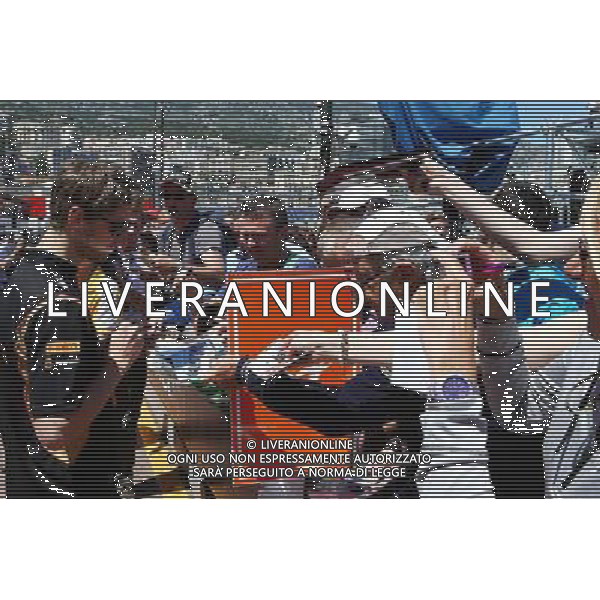 Romain Grosjean (FRA) Lotus F1 Team signs autographs for the fans. 23.05.2014. Formula 1 World Championship, Rd 6, Monaco Grand Prix, Monte Carlo, Monaco, Friday. - www.xpbimages.com, EMail: requests@xpbimages.com - copy of publication required for printed pictures. Every used picture is fee-liable. Â© Copyright: Batchelor / XPB Images /AGENZIA ALDO LIVERANI SAS - ITALY ONLY - EDITORIAL USE ONLY - GP MONACO F1 PROVE LIBERE