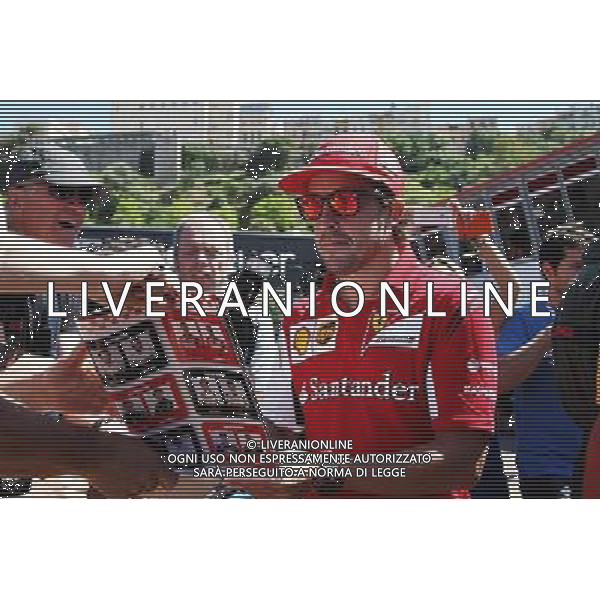 Fernando Alonso (ESP) Ferrari signs autographs for the fans. 23.05.2014. Formula 1 World Championship, Rd 6, Monaco Grand Prix, Monte Carlo, Monaco, Friday. - www.xpbimages.com, EMail: requests@xpbimages.com - copy of publication required for printed pictures. Every used picture is fee-liable. Â© Copyright: Schaber / XPB Images /AGENZIA ALDO LIVERANI SAS - ITALY ONLY - EDITORIAL USE ONLY - GP MONACO F1 PROVE LIBERE