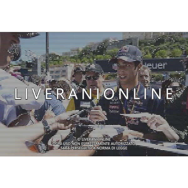 Daniel Ricciardo (AUS) Red Bull Racing signs autographs for the fans. 23.05.2014. Formula 1 World Championship, Rd 6, Monaco Grand Prix, Monte Carlo, Monaco, Friday. - www.xpbimages.com, EMail: requests@xpbimages.com - copy of publication required for printed pictures. Every used picture is fee-liable. Â© Copyright: Price / XPB Images /AGENZIA ALDO LIVERANI SAS - ITALY ONLY - EDITORIAL USE ONLY - GP MONACO F1 PROVE LIBERE