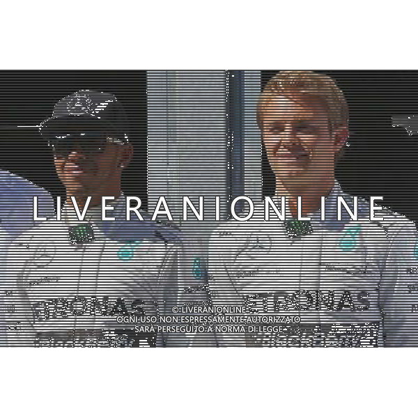 (L to R): Lewis Hamilton (GBR) Mercedes AMG F1 with team mate Nico Rosberg (GER) Mercedes AMG F1. 24.05.2014. Formula 1 World Championship, Rd 6, Monaco Grand Prix, Monte Carlo, Monaco, Qualifying Day - www.xpbimages.com, EMail: requests@xpbimages.com - copy of publication required for printed pictures. Every used picture is fee-liable. © Copyright: Batchelor / XPB Images AG ALDO LIVERANI SAS ONLY ITALY