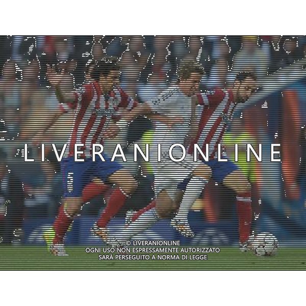 Real Madrid\'s Fabio Coentrao vies for possession with Atletico Madrid\'s Tiago and Juanfran Photographer Ian Cook/CameraSport Football - UEFA Champions League Final 2014 - Real Madrid v Atletico Madrid - Saturday 24th May 2014 - Stadium of Light - Lisbon - Portugal © CameraSport - 43 Linden Ave. Countesthorpe. Leicester. England. LE8 5PG - Tel: +44 (0) 116 277 4147 - admin@camerasport.com - www.camerasport.com /AGENZIA ALDO LIVERANI SAS - ITALY ONLY - Real Madrid - Atletico Madrid UEFA Champions League 2013/2014 Finale Lisbona (Portogallo) - 24.05.2014