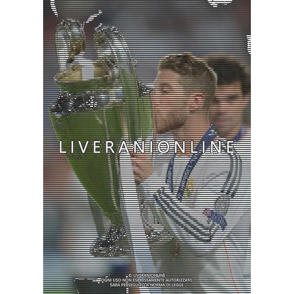 Real Madrid\'s Sergio Ramos kisses the champions league trophy Photographer Ian Cook/CameraSport Football - UEFA Champions League Final 2014 - Real Madrid v Atletico Madrid - Saturday 24th May 2014 - Stadium of Light - Lisbon - Portugal © CameraSport - 43 Linden Ave. Countesthorpe. Leicester. England. LE8 5PG - Tel: +44 (0) 116 277 4147 - admin@camerasport.com - www.camerasport.com /AGENZIA ALDO LIVERANI SAS - ITALY ONLY - Real Madrid - Atletico Madrid UEFA Champions League 2013/2014 Finale Lisbona (Portogallo) - 24.05.2014