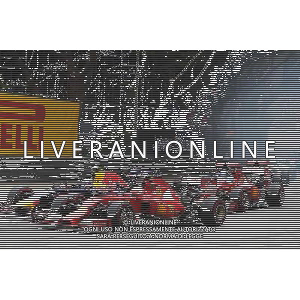 Kimi Raikkonen (FIN) Ferrari F14-T and Daniel Ricciardo (AUS) Red Bull Racing RB10 battle for position at the start of the race. 25.05.2014. Formula 1 World Championship, Rd 6, Monaco Grand Prix, Monte Carlo, Monaco, Race Day. - www.xpbimages.com, EMail: requests@xpbimages.com - copy of publication required for printed pictures. Every used picture is fee-liable. © Copyright: Charniaux / XPB Images ITALY ONLY - GP MONACO F1 GARA /AGENZIA ALDO LIVERANI SAS - ITALY ONLY - EDITORIAL USE ONLY