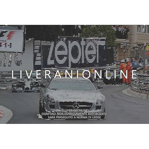 Nico Rosberg (GER) Mercedes AMG F1 W05 leads behind the FIA Safety Car. 25.05.2014. Formula 1 World Championship, Rd 6, Monaco Grand Prix, Monte Carlo, Monaco, Race Day. - www.xpbimages.com, EMail: requests@xpbimages.com - copy of publication required for printed pictures. Every used picture is fee-liable. © Copyright: Price / XPB Images ITALY ONLY - GP MONACO F1 GARA /AGENZIA ALDO LIVERANI SAS - ITALY ONLY - EDITORIAL USE ONLY