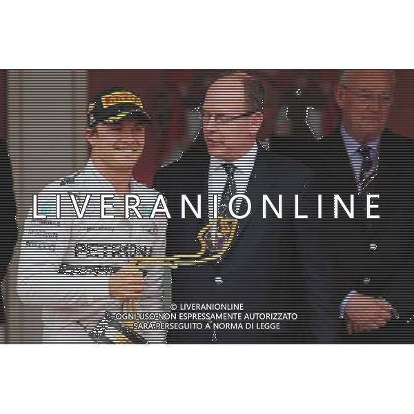 Race winner Nico Rosberg (GER) Mercedes AMG F1 celebrates on the podium with HSH Prince Albert of Monaco (MON). 25.05.2014. Formula 1 World Championship, Rd 6, Monaco Grand Prix, Monte Carlo, Monaco, Race Day. - www.xpbimages.com, EMail: requests@xpbimages.com - copy of publication required for printed pictures. Every used picture is fee-liable. © Copyright: Charniaux / XPB Images ©/AGENZIA ALDO LIVERANI SAS - ITALY ONLY - EDITORIAL USE ONLY - GP MONACO F1 GARA