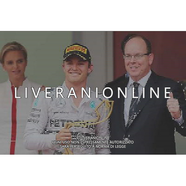 Race winner Nico Rosberg (GER) Mercedes AMG F1 celebrates on the podium with HSH Prince Albert of Monaco (MON). 25.05.2014. Formula 1 World Championship, Rd 6, Monaco Grand Prix, Monte Carlo, Monaco, Race Day. - www.xpbimages.com, EMail: requests@xpbimages.com - copy of publication required for printed pictures. Every used picture is fee-liable. © Copyright: Moy / XPB Images ©/AGENZIA ALDO LIVERANI SAS - ITALY ONLY - EDITORIAL USE ONLY - GP MONACO F1 GARA