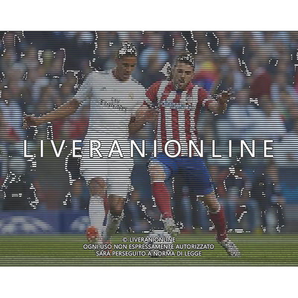 LISBON, PORTUGAL - MAY 24: Varane (L) of Real Madrid CF competes for the ball with David Villa of Atletico de Madrid during the UEFA Champions League Final match between Real Madrid CF and Atletico de Madrid at Estadio da Luz on May 24, 2014 in Lisbon, Portugal. (Photo by David Aliaga/Newspix) --- Newspix.pl POLAND AND SPAIN OUT!!! AG ALDO LIVERANI SAS ONLY ITALY