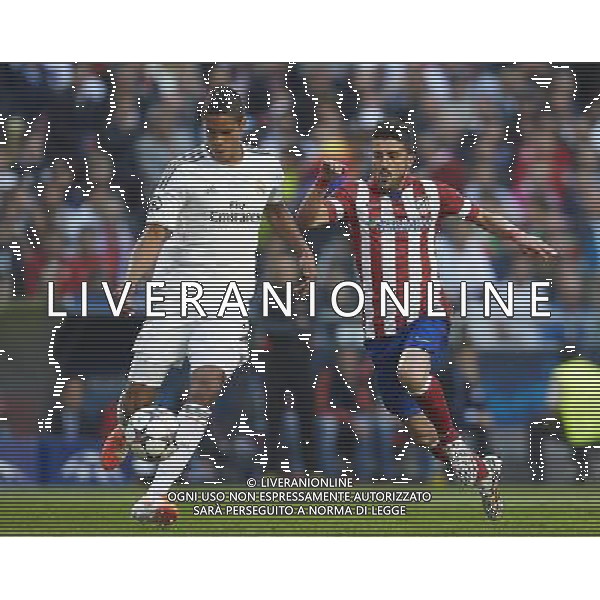 LISBON, PORTUGAL - MAY 24: Varane (R) of Real Madrid CF competes for the ball with David Villa of Atletico de Madrid during the UEFA Champions League Final match between Real Madrid CF and Atletico de Madrid at Estadio da Luz on May 24, 2014 in Lisbon, Portugal. (Photo by David Aliaga/Newspix) --- Newspix.pl SPAIN AND POLAND OUT!!! AG ALDO LIVERANI SAS ONLY ITALY