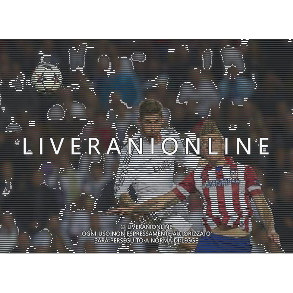 LISBON, PORTUGAL - MAY 24: Sergio Ramos (L) of Real Madrid CF heads the ball prior to score with Alderweireld of Atletico de Madrid during the UEFA Champions League Final match between Real Madrid CF and Atletico de Madrid at Estadio da Luz on May 24, 2014 in Lisbon, Portugal. (Photo by David Aliaga/Newspix) --- Newspix.pl POLAND AND SPAIN OUT!!! AG ALDO LIVERANI SAS ONLY ITALY