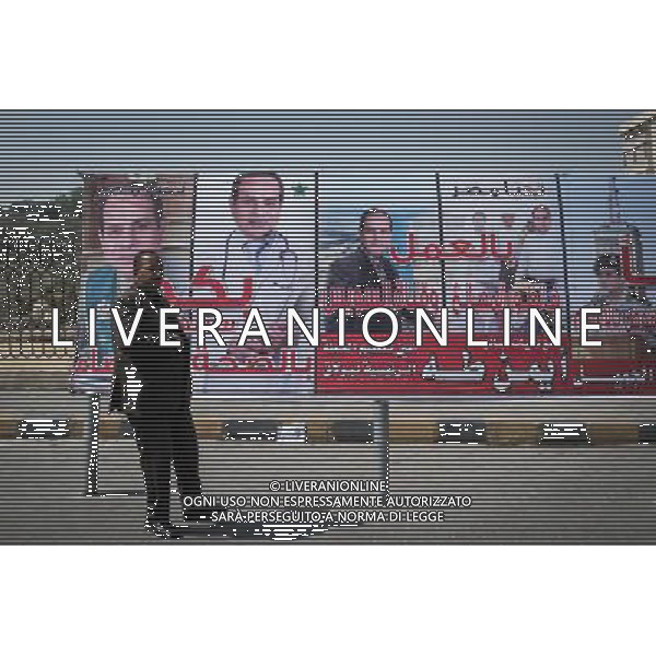 (140527) -- CAIRO, May 27, 2014 () -- A man stands in front of posters of Egypt\'s presidential candidate Abdel-Fattah al-Sisi in the neighborhood of Gamalia, which is believed to be his hometown, in old Cairo, Egypt, on May 27, 2014. Tuesday is the final day of the two-day presidential elections, the first polls since the ouster of former Islamist President Mohamed Morsi last year. Ex-military chief Abdel-Fattah al-Sisi, who led Morsi\'s overthrow, is poised to score an easy win over his sole rival in the race, leftist leader Hamdeen Sabahy, who came third in the 2012 presidential election. (/Pan Chaoyue) (djj) ©PHOTOSHOT/AGENZIA ALDO LIVERANI SAS - ITALY ONLY - EDITORIAL USE ONLY